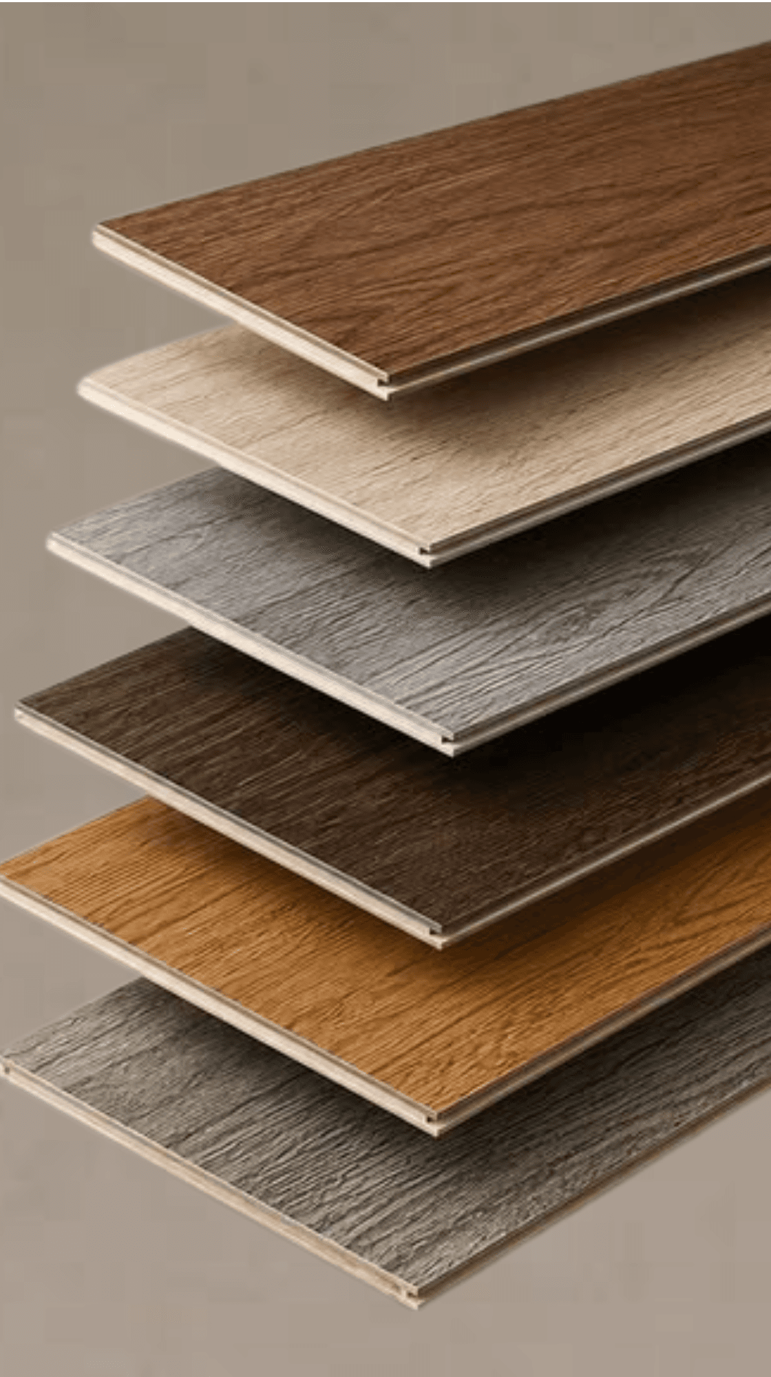 Stack of laminate and vinyl flooring sample planks in various tones